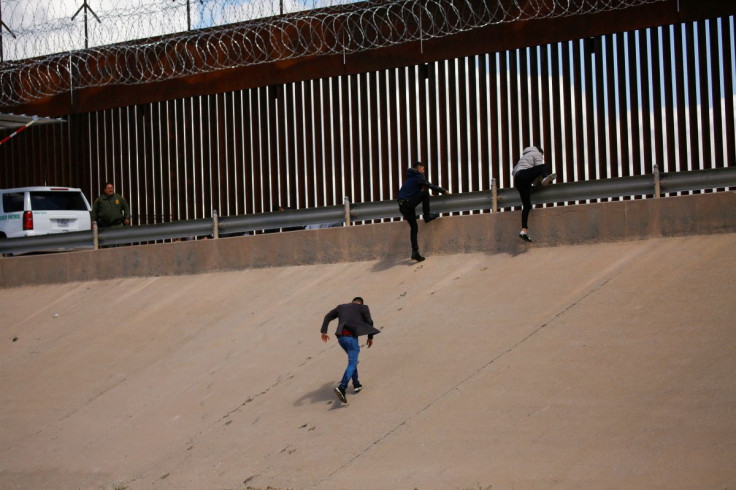 Asylum-seeking migrants walk out of the Rio Bravo river after crossing it to turn themselves in to U.S. Border Patrol agents to request asylum in El Paso, Texas, U.S., as seen from Ciudad Juarez, Mexico March 30, 2022.