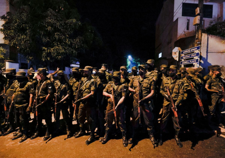 Members of the Sri Lankan army stand guard near President Gotabaya Rajapaksa's residence during a protest against him as many parts of the crisis-hit country faced up to 13 hours without electricity due to a shortage of foreign currency to import fuel, in