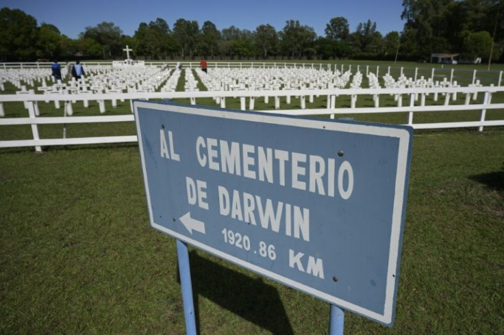 A board marks the distance to the Darwin cemetery of the Falklands, from the Cenotaph, a replica with 649 crosses with the names of the fallen Argentine soldiers in Pilar in March 2022, ahead of the 40th anniversary of the Falklands War