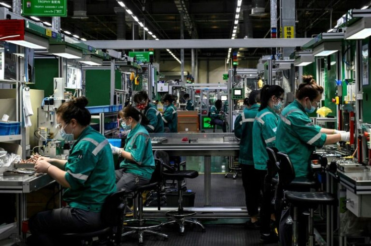 China's factory output slumped to its lowest in two years in March, the Caixin PMI showed