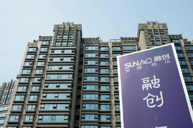 An advertisement of property developer Sunac China Holdings is seen at a residential complex in Shanghai, China March 25, 2018.