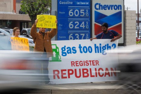 Republican activists approach people filling up their cars, as fuel prices rise, hoping to register them to vote for their party in Garden Grove, California, U.S., March 29, 2022. Picture taken March 29, 2022.   