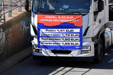 A sign with fuel prices in different European countries is seen as truck drivers take part in a demonstration against high fuel prices, in Hamburg, Germany, March 19, 2022. 