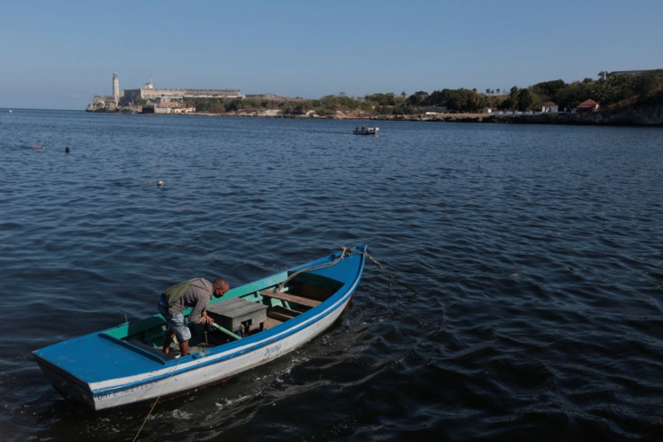 A fisherman works in his boat in Havana, Cuba, March 29, 2022. Picture taken March 29, 2022. 