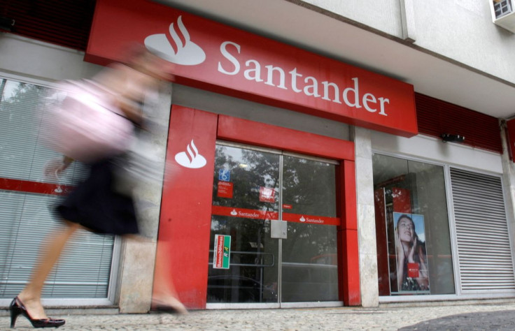 A woman walks past Santander bank branch in Rio de Janeiro October 7, 2009.