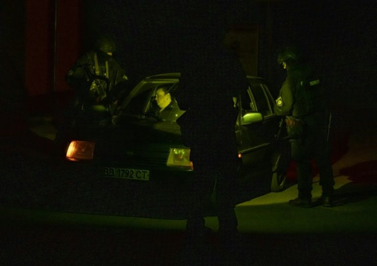 The patrol holds up a vehicle, brusquely pulling the two passengers out to interrogate them