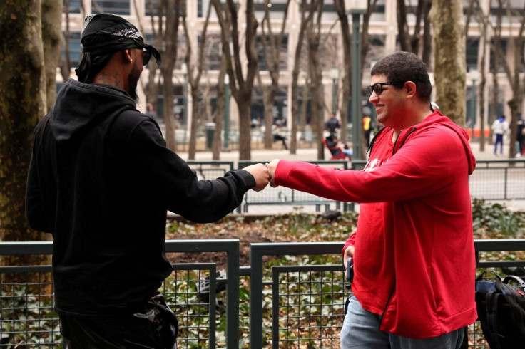 Amazon JFK8 distribution center union organizers Chris Smalls and Jason Anthony greet one another as they arrive to observe the vote count to unionize workers at the NLRB office in Brooklyn, New York City, U.S., March 31, 2022. 