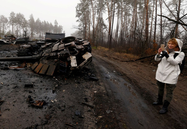 Iryna Vereshchagina, films with her mobile phone destroyed Russian tanks and armoured vehicles, amid Russia's invasion of Ukraine in Dmytrivka village, west of Kyiv, Ukraine April 1, 2022. 