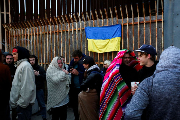 Ukrainians who recently arrived to Mexico after fleeing the Russian invasion of their homeland wait for their turn to try to get into the U.S. at the San Ysidro Port of Entry of the U.S.-Mexico border, in Tijuana, Mexico March 30, 2022.