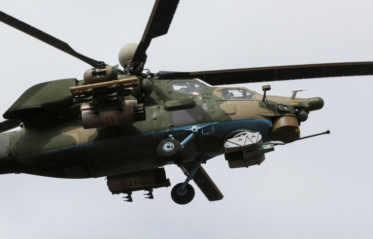 A Russian Air Force helicopter flies in the course of Ukraine-Russia conflict near the southern port city of Mariupol, Ukraine April 1, 2022. 