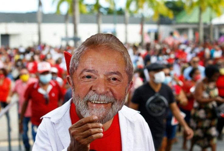 A supporter of former Brazilian President (2002-2011) Luiz Inacio Lula da Silva wears a mask depicting him during the campaign launch of Jeronimo Rodrigues, candidate for Governor of Bahia state for the Workers´Party (PT), in Salvador, Bahia, Brazil