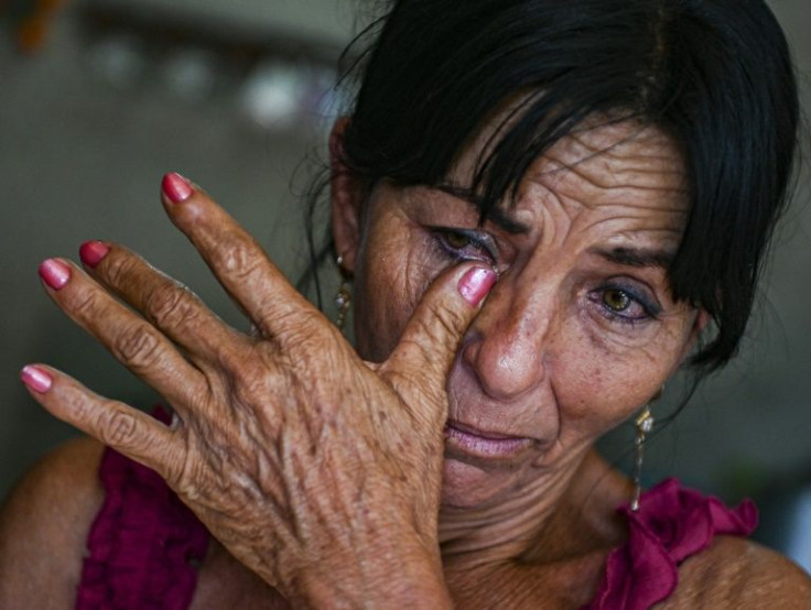 Virgen Frometa weeps as she talks about the sentence handed out to her brother Luis, a Cuban with German citizenship who was arrested during unprecedented anti-government protests in July 2021