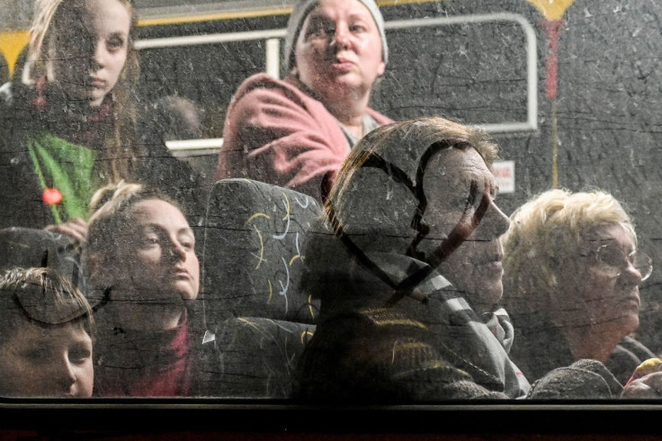 People who flee Mariupol and Melitopol as Russiaâs attack on Ukraine continues, wait inside an evacuee bus at a collecting point in Zaporizhzhia, Ukraine April 1, 2022. Picture taken April 1, 2022. 