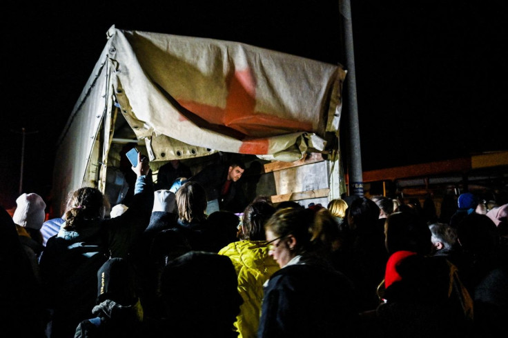 People who flee Mariupol and Melitopol as Russiaâs attack on Ukraine continues, wait around an evacuee cargo truck at a collecting point in Zaporizhzhia, Ukraine April 1, 2022. 