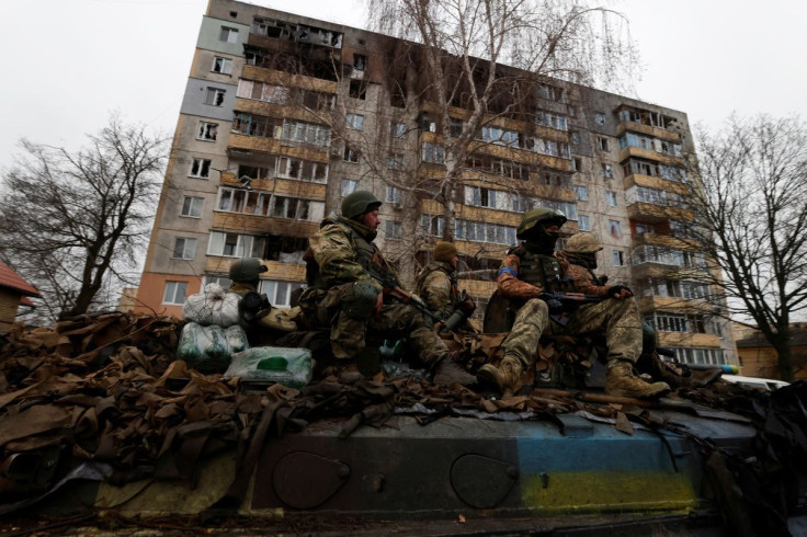 Ukrainian soldiers are pictured on their military vehicle, amid Russia's invasion on Ukraine in Bucha, in Kyiv region, Ukraine April 2, 2022. 