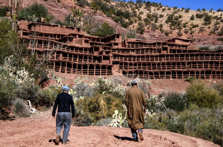 Beekepers walk towards the Inzerki apiary; experts say it is the oldest traditional, collective beehive in the world, but today it is under threat amid a changing climate