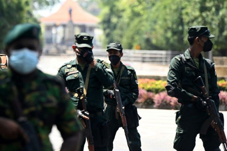 Soldiers stand guard as opposition MPs protest in the Sri Lankan capital