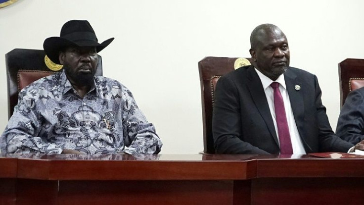South Sudanese President Salva Kiir (left) and Vice President Riek Machar (right) attend the signing ceremony in Juba
