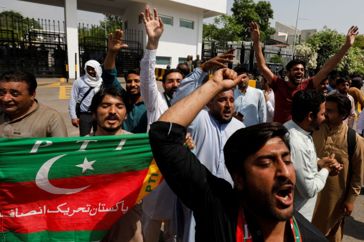 Supporters of the Pakistan Tehreek-e-Insaf (PTI) political party, chant slogans in support of Pakistani Prime Minister Imran Khan, outside parliament building Islamabad, Pakistan April 3, 2022. 