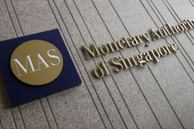 The logo of the Monetary Authority of Singapore (MAS) is pictured at its building in Singapore in this February 21, 2013 file photo.  