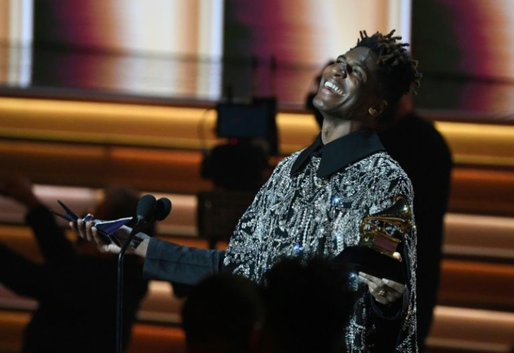 US singer Jon Batiste celebrates after winning the Album of the Year Grammy for "We Are"