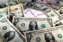 U.S. dollar notes are seen in front of a stock graph in this November 7, 2016 picture illustration. 