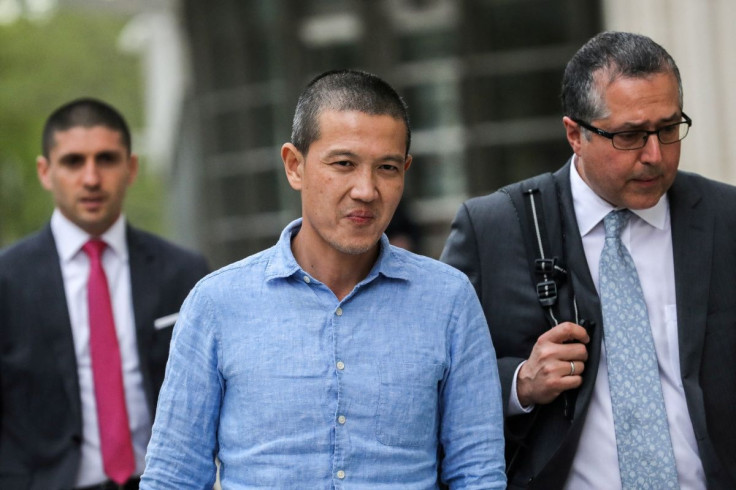 Ex-Goldman Sachs banker Roger Ng and his lawyer Marc Agnifilo leave the federal court in New York, U.S., May 6, 2019. 
