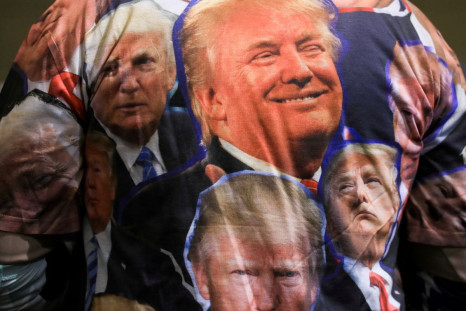 A supporter wears a t-shirt with faces of the former president during a rally held by former U.S. President Donald Trump in Washington Township, Michigan, U.S. April 2, 2022. 