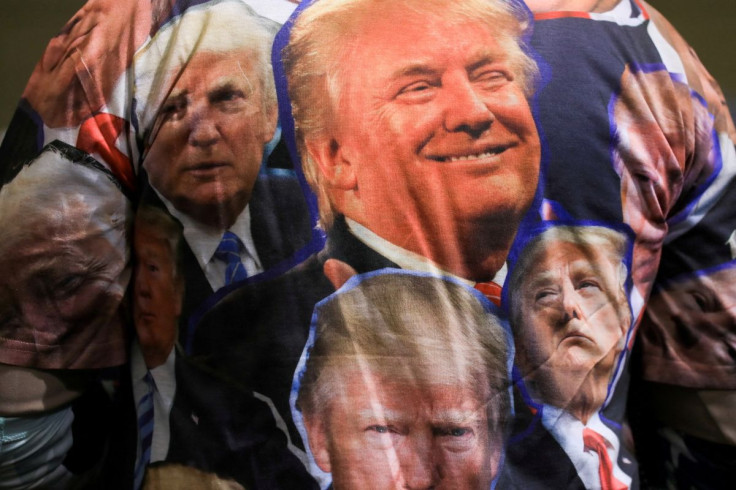 A supporter wears a t-shirt with faces of the former president during a rally held by former U.S. President Donald Trump in Washington Township, Michigan, U.S. April 2, 2022. 