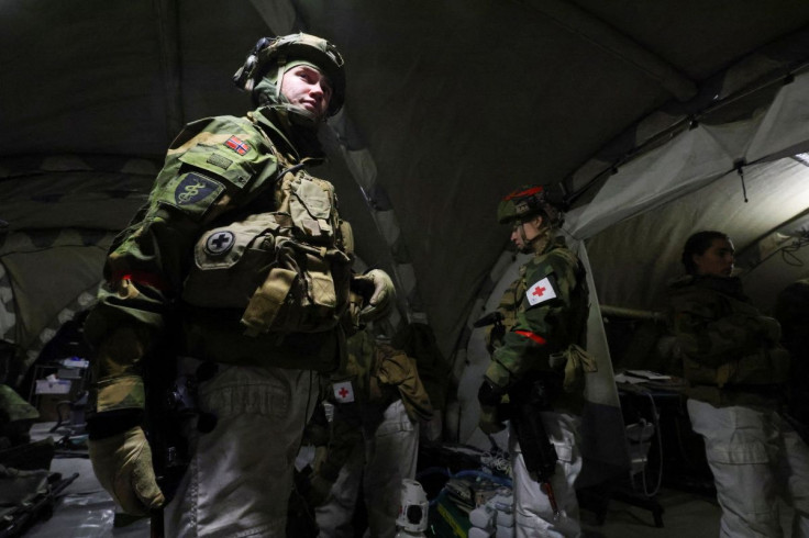 Norwegian and Swedish army medics simulate the evacuation of a field hospital as part of military exercise called "Cold Response 2022", gathering around 30,000 troops from NATO member countries plus Finland and Sweden, amid Russia's invasion of Ukraine, i