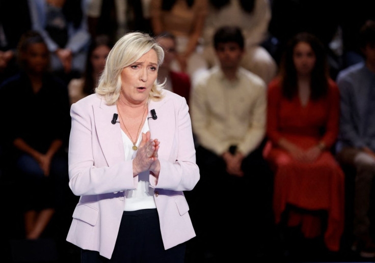 French far-right Rassemblement National (RN) party Member of Parliament and presidential candidate Marine Le Pen talks during the show "La France face a la guerre" (France in the Face of War) broadcasted on French TV channel TF1, in Saint-Denis, north of