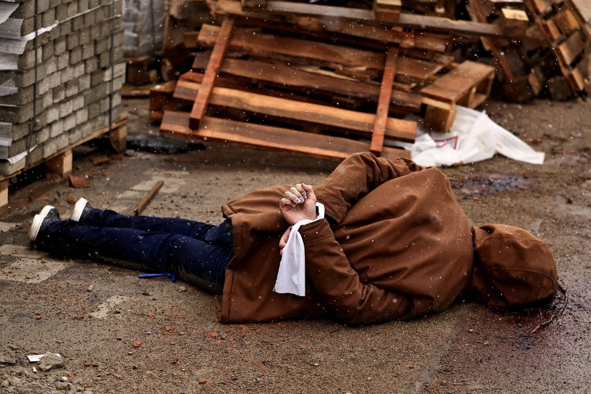 In Ukrainian Street, A Corpse With Hands Bound And A Bullet Wound To