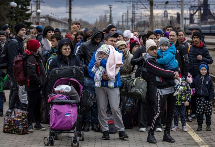 Families fleeing the eastern city of Kramatorsk in the Donbas region