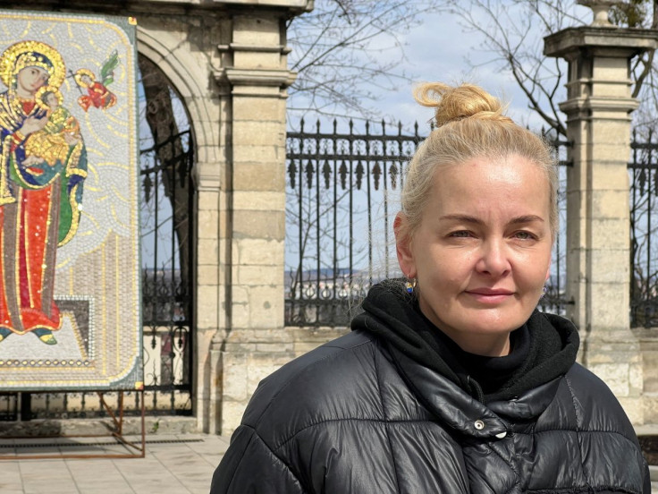 Ukrainian refugee Luidmyla Nazarova waits for humanitarian aid to depart St. George's Cathedral, amid Russia's invasion of Ukraine, in Lviv, Ukraine April 4, 2022.
