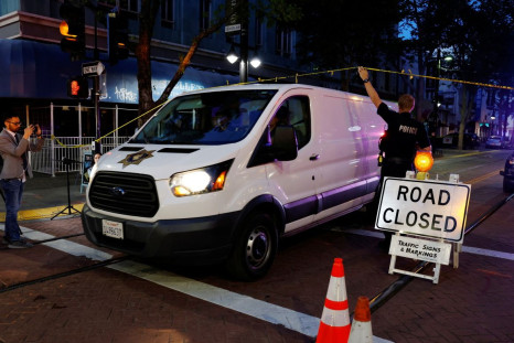 A coroner's van leaves the scene of an early-morning shooting in a stretch of downtown near the Golden 1 Center arena in Sacramento, California, U.S. April 3, 2022. 