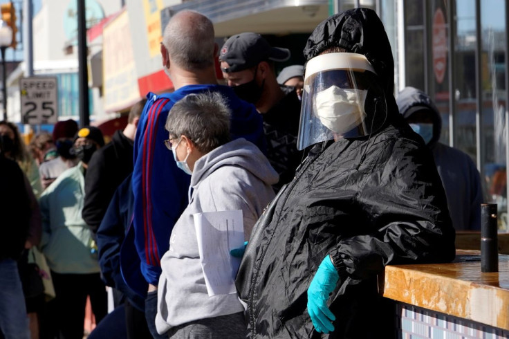 People wait in line to be tested for coronavirus disease (COVID-19) at the Tower Theatre in Oklahoma City, Oklahoma, U.S., January 11, 2022.  