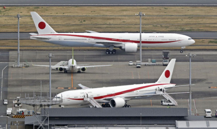 A government's special plane (top) transporting Ukrainian refugees, arrives at the Haneda airport in Tokyo, Japan April 5, 2022, in this photo taken by Kyodo. Mandatory credit Kyodo/via REUTERS