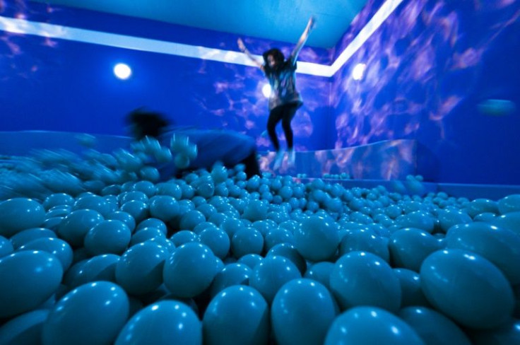 People visit the "You Underwater" room in the Youseum near Stockholm