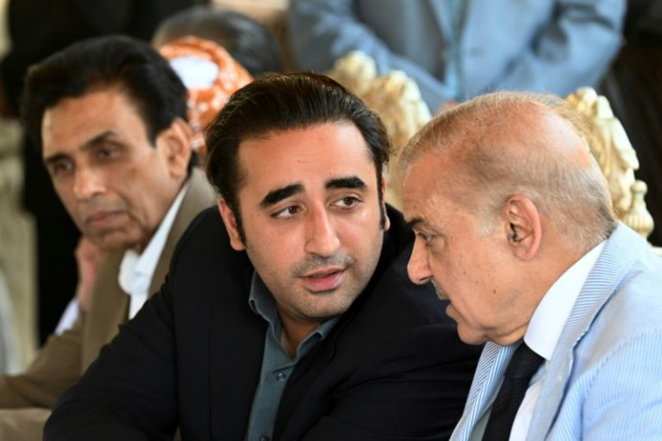 Bilawal Bhutto Zardari (left) chats to fellow opposition leader Shehbaz Sharif in Islamabad