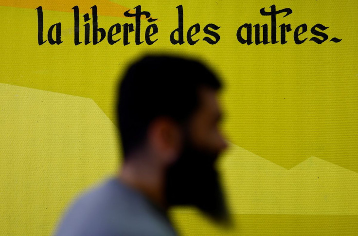 Karim Daoud, head of the Allonnes mosque's associations, poses at the city's youth services in Allonnes, near Le Mans, France March 15, 2022. The sentence means: "The freedom of others". Picture taken March 15, 2022.