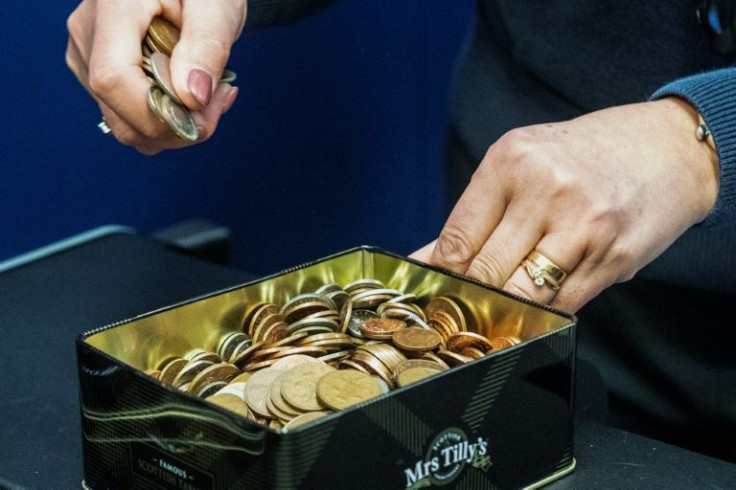 Donna Corrigan, 40, brought a box full of coins to deposit into her bank account