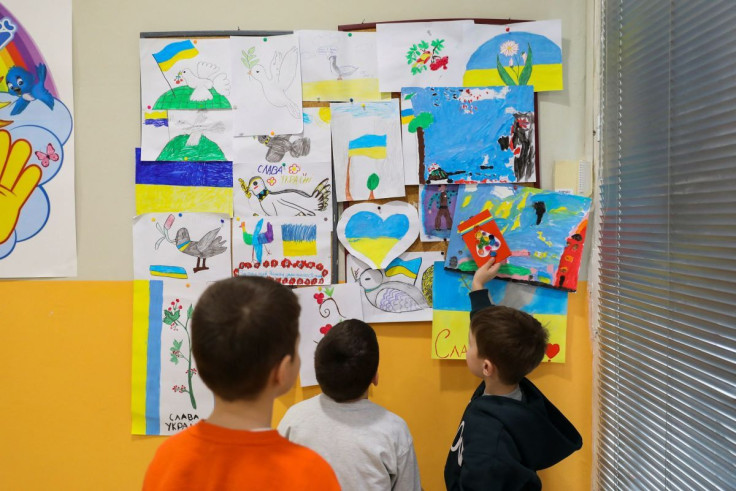 Ukrainian children look at drawings, at the Berehynia Cultural and Educational Center, after fleeing the Russian invasion of Ukraine, in Athens, Greece, March 28, 2022. Picture taken March 28, 2022. 