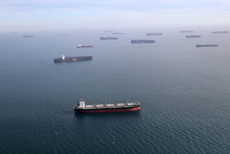 Container ships and oil tankers wait in the ocean outside the Port of Long Beach-Port of Los Angeles complex in Los Angeles, California, U.S., April 7, 2021. 