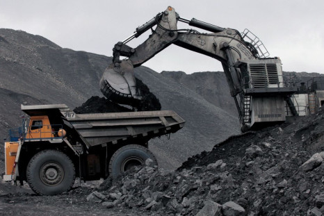 A machine loads a truck with coal at the Chernigovsky opencast colliery, outside the town of Beryozovsky, Kemerovo region, Siberia, Russia, April 4, 2016. 