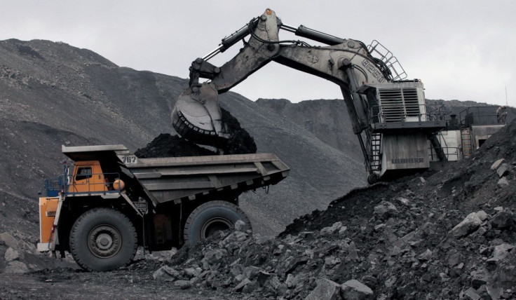 A machine loads a truck with coal at the Chernigovsky opencast colliery, outside the town of Beryozovsky, Kemerovo region, Siberia, Russia, April 4, 2016. 