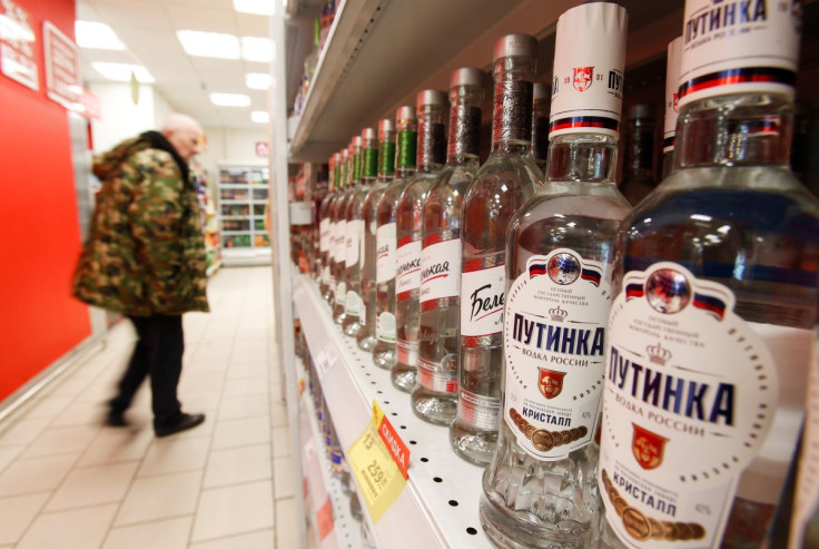 A customer walks past shelves with bottles of vodka in a supermarket amid the coronavirus disease (COVID-19) pandemic in Moscow, Russia April 8, 2020. 
