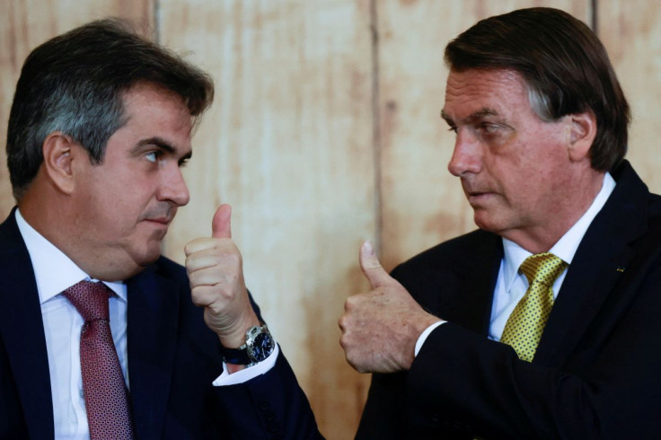 Brazil's President Jair Bolsonaro and his Chief of Staff Ciro Nogueira gesture during a ceremony to commemorate Forro Day, at the Planalto Palace in Brasilia, Brazil December 13, 2021.