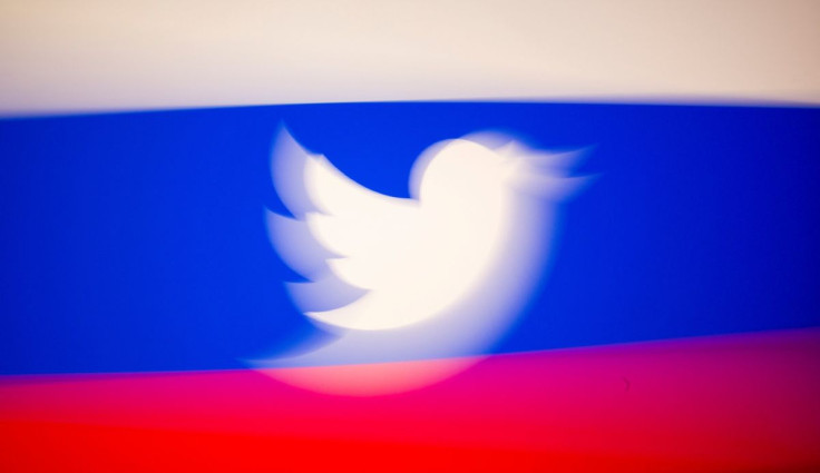 Twitter logo and a Russian flag are displayed in this illustration picture taken March 10, 2021.