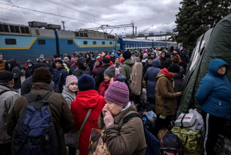 People wait to board a train at Kramatorsk central station as they flee the Donbas regionamid fears of a major Russian military offensive