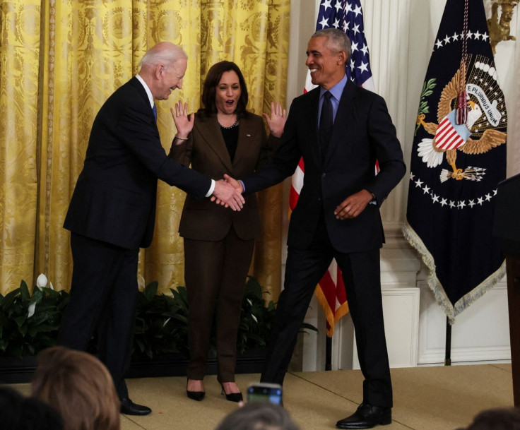 U.S. VPresident Joe Biden greets friend and former President Barack Obama during an event on the Affordable Care Act, the former president's top legislative accomplishment, as Vice President Kamala Harris reacts in the East Room at the White House in Wash